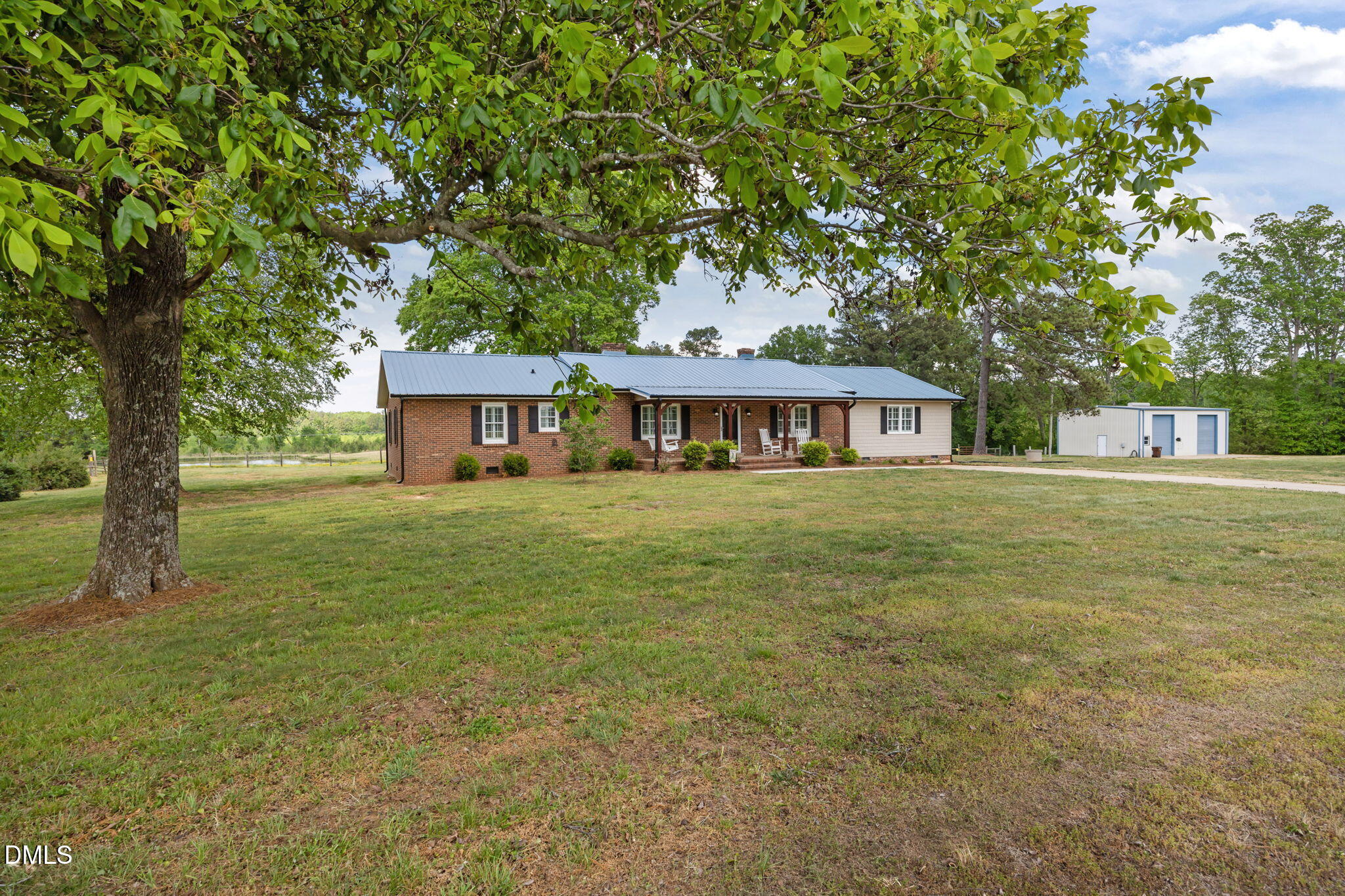 3611 Chewning Road Oxford, NC 27565 - Photo 1 of 45 a front view of a house with a garden