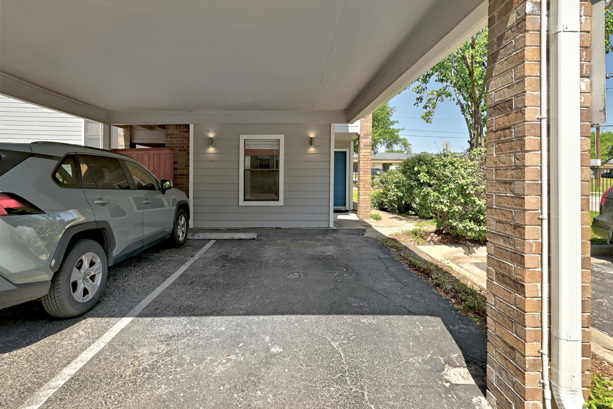 7635 Guadalupe Street, Unit 1002 Austin, TX 78752 - Photo 24 of 27 a car parked in front of a house