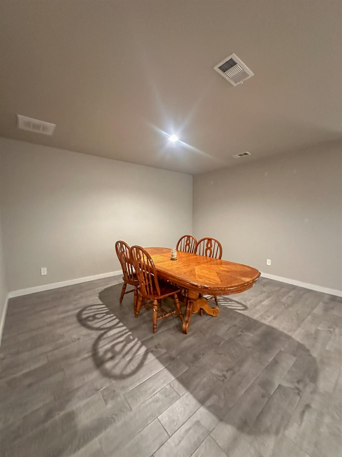 323 Ranger Street Wolfforth, TX 79382 - Photo 11 of 48 a dining room with a table and chairs