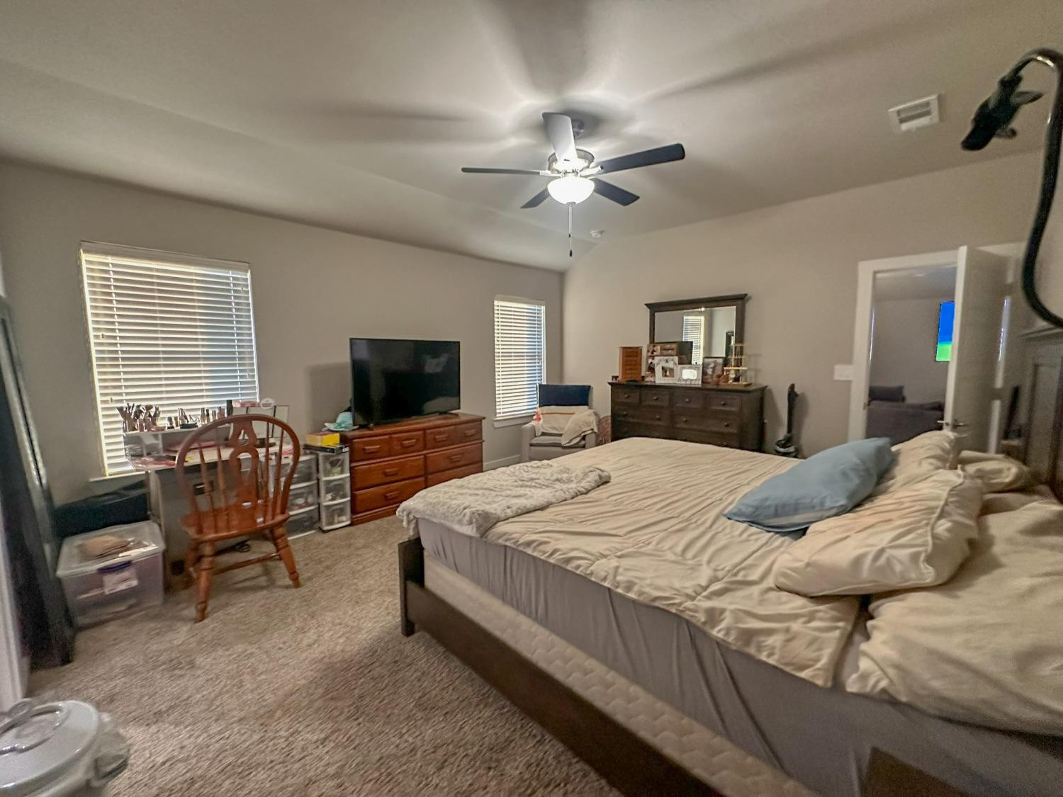 323 Ranger Street Wolfforth, TX 79382 - Photo 18 of 48 a bedroom with a bed and a flat screen tv