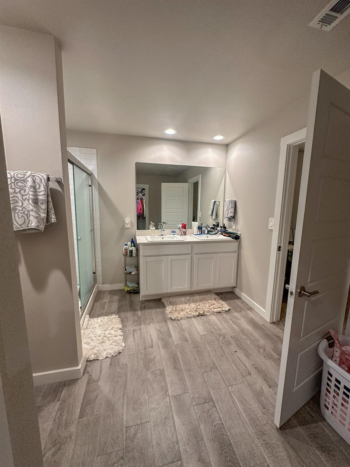 323 Ranger Street Wolfforth, TX 79382 - Photo 19 of 48 a bedroom with a bed and a large mirror
