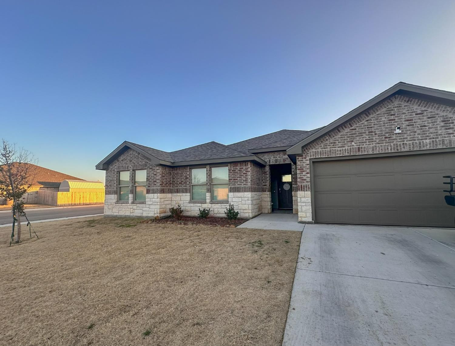 323 Ranger Street Wolfforth, TX 79382 - Photo 2 of 48 a view of a house with a sink and a yard