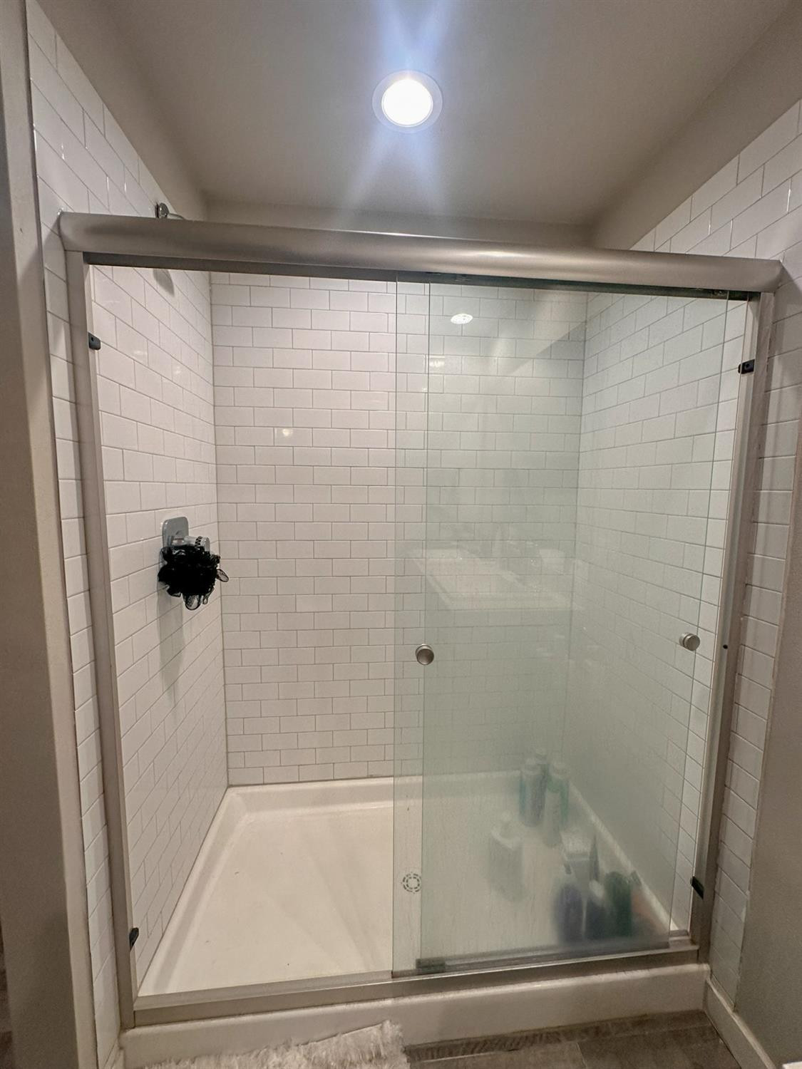 323 Ranger Street Wolfforth, TX 79382 - Photo 22 of 48 a bathroom with a glass shower door
