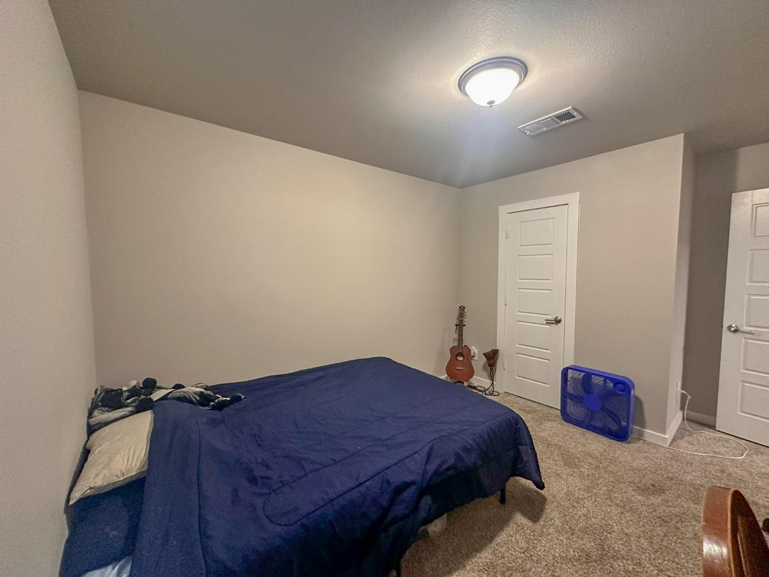 323 Ranger Street Wolfforth, TX 79382 - Photo 26 of 48 a spacious bedroom with a bed and a cabinets