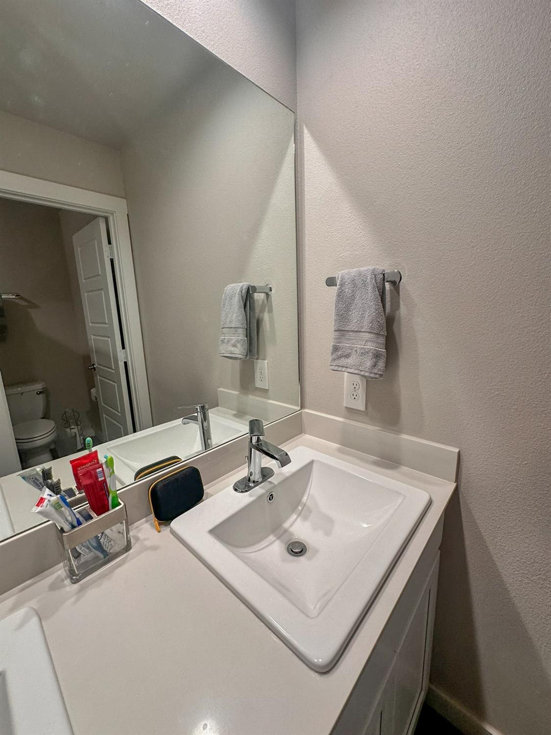 323 Ranger Street Wolfforth, TX 79382 - Photo 30 of 48 a bathroom with a sink and a mirror