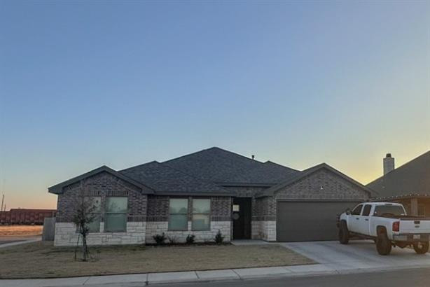 323 Ranger Street Wolfforth, TX 79382 - Photo 3 of 48 a front view of a house with garden
