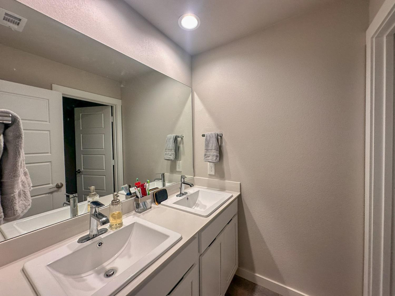 323 Ranger Street Wolfforth, TX 79382 - Photo 31 of 48 a bathroom with a sink and a mirror