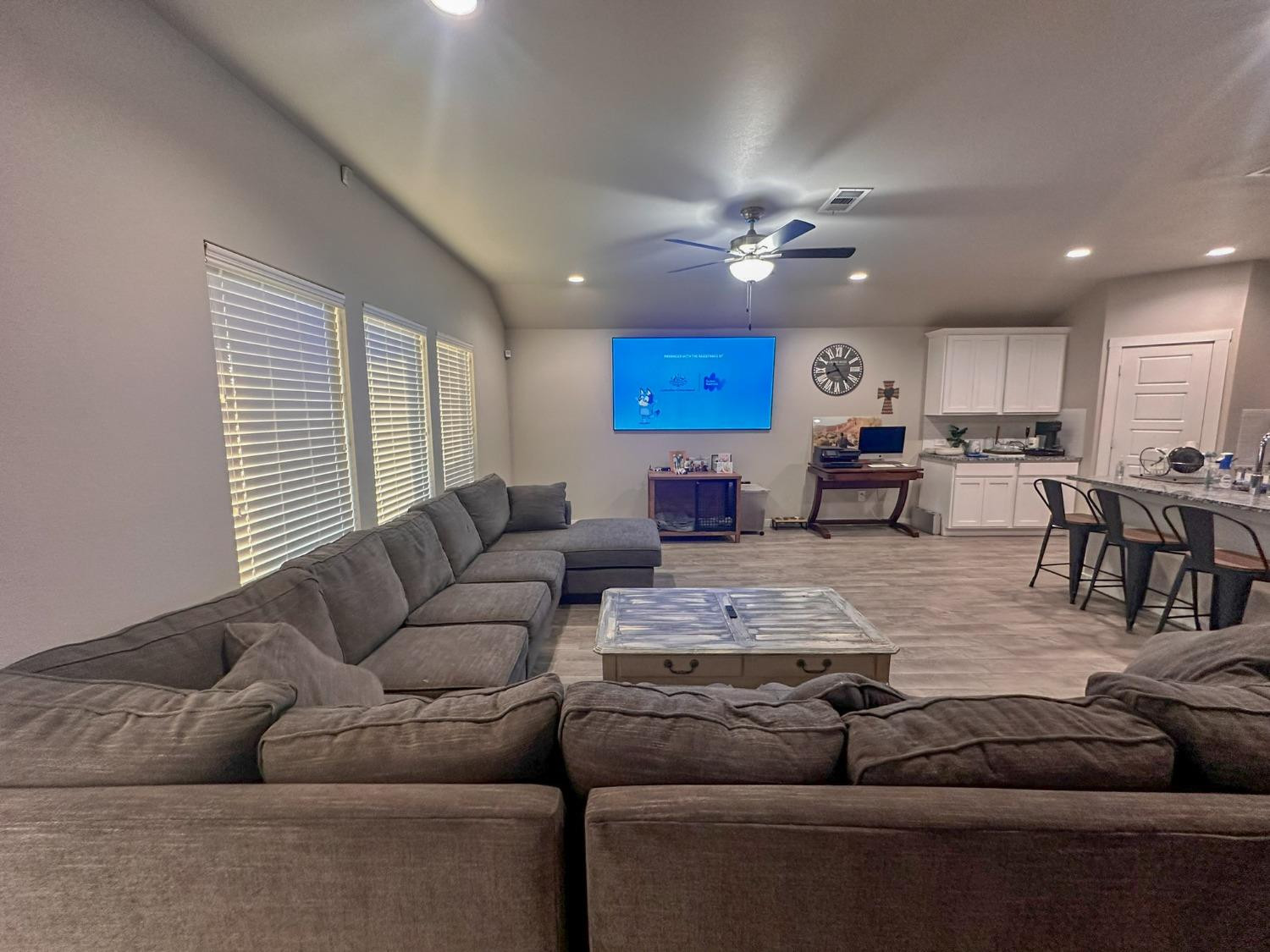 323 Ranger Street Wolfforth, TX 79382 - Photo 6 of 48 a living room with furniture kitchen view and a chandelier