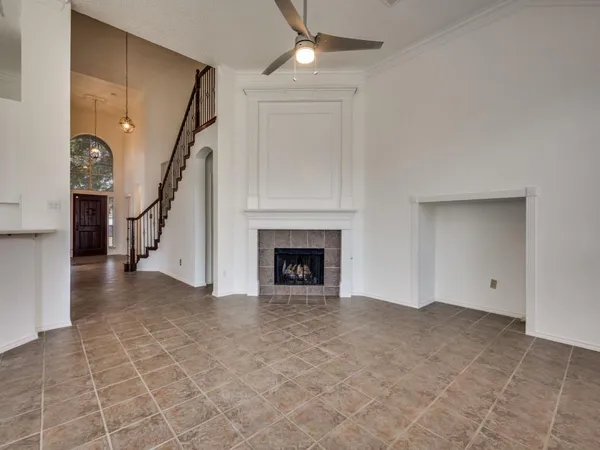 a view of an empty room with a fireplace