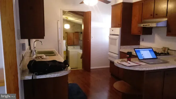 a view of a balcony with yard