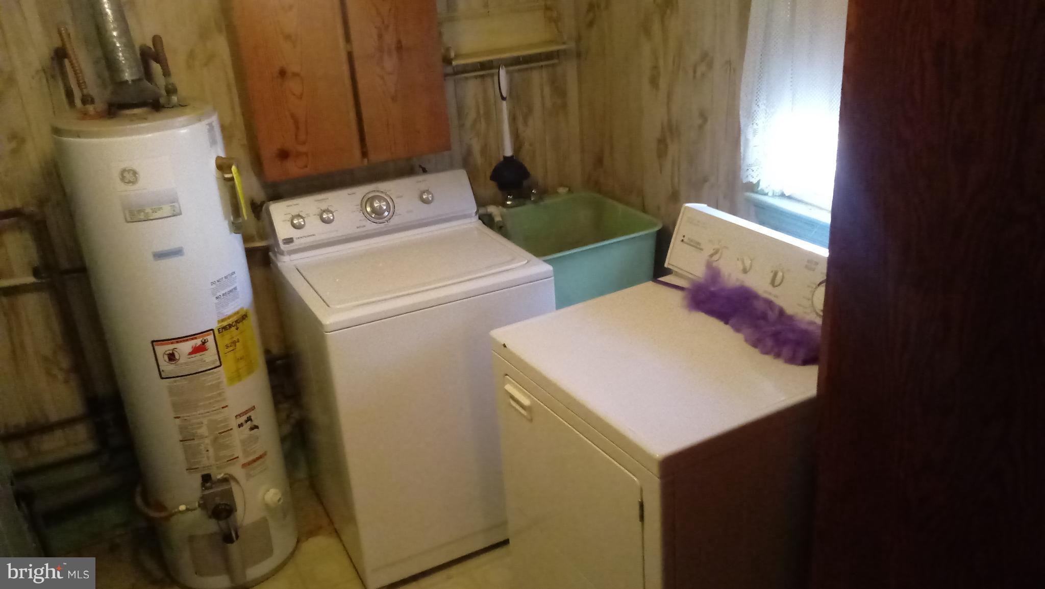 1533 Leslie Road Dundalk, MD 21222 - Photo 4 of 9 a utility room with dryer and washer