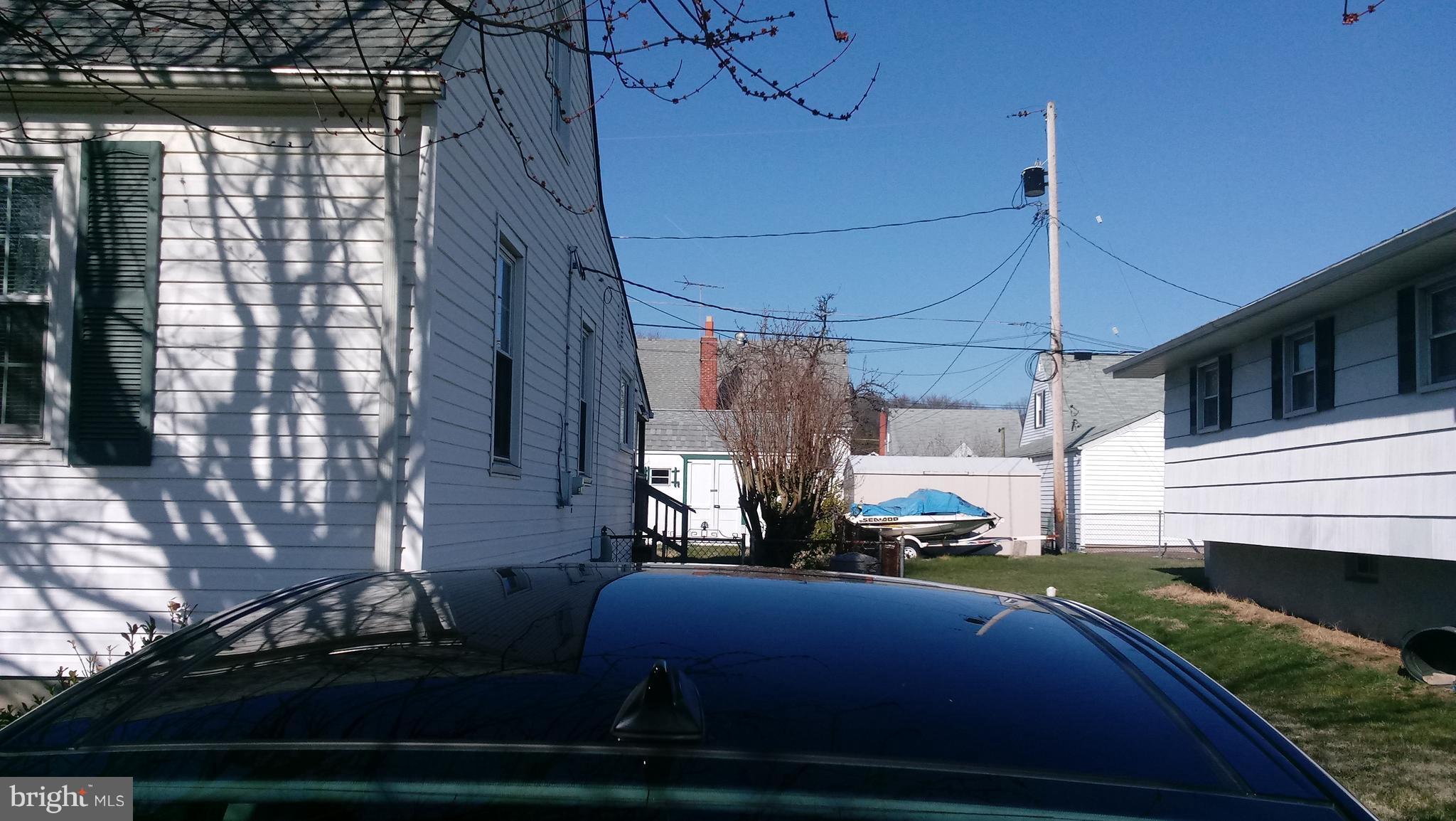 1533 Leslie Road Dundalk, MD 21222 - Photo 8 of 9 a view of a patio with table and chairs with wooden floor and fence