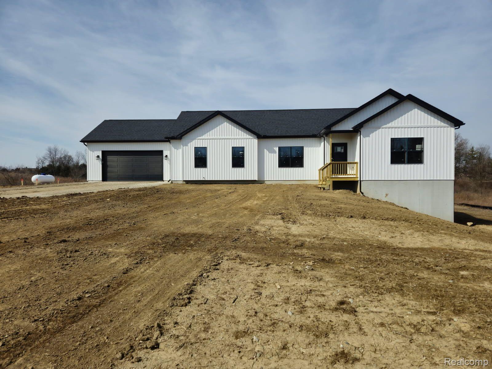 3560 South Creek Road Dryden, MI 48428 - Photo 1 of 21 Upgraded black windows on front elevation