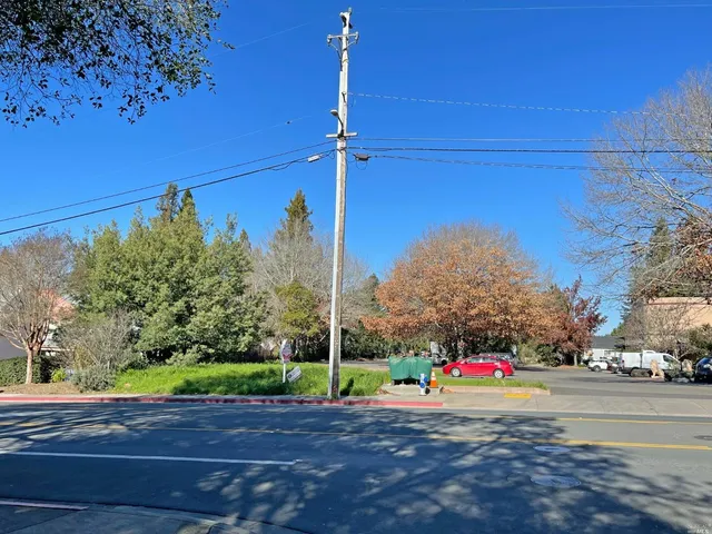 a view of a road with a building in the background