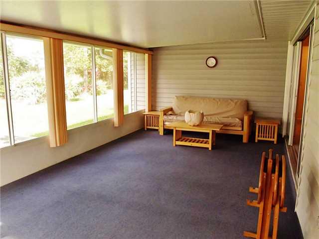 6940 Southeast Lillian Court Stuart, FL 34997 - Photo 14 of 25 a living room with furniture and a window