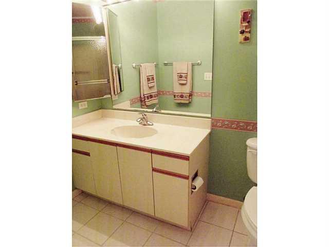 6940 Southeast Lillian Court Stuart, FL 34997 - Photo 20 of 25 a bathroom with a sink and a mirror