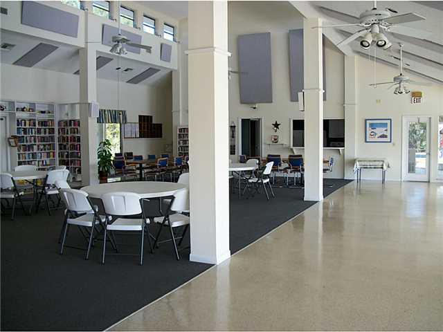 6940 Southeast Lillian Court Stuart, FL 34997 - Photo 24 of 25 a view of a living room and dining room