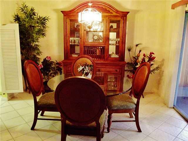 6940 Southeast Lillian Court Stuart, FL 34997 - Photo 6 of 25 a view of a chairs in a patio