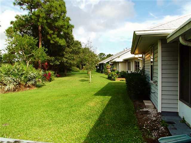 6940 Southeast Lillian Court Stuart, FL 34997 - Photo 9 of 25 a view of a house with a garden