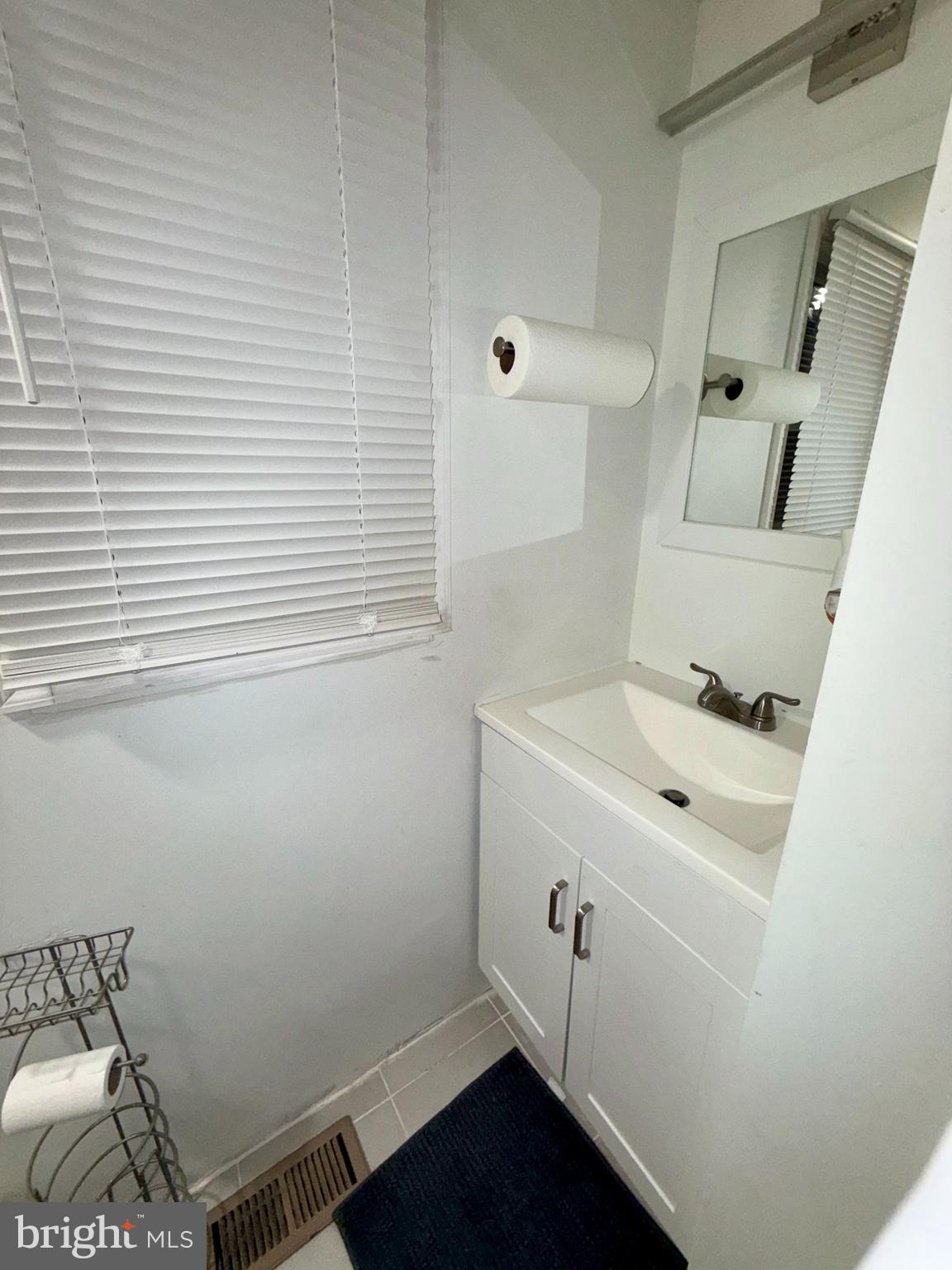 299 Rips Drive Lothian, MD 20711 - Photo 11 of 18 a bathroom with a sink and a vanity