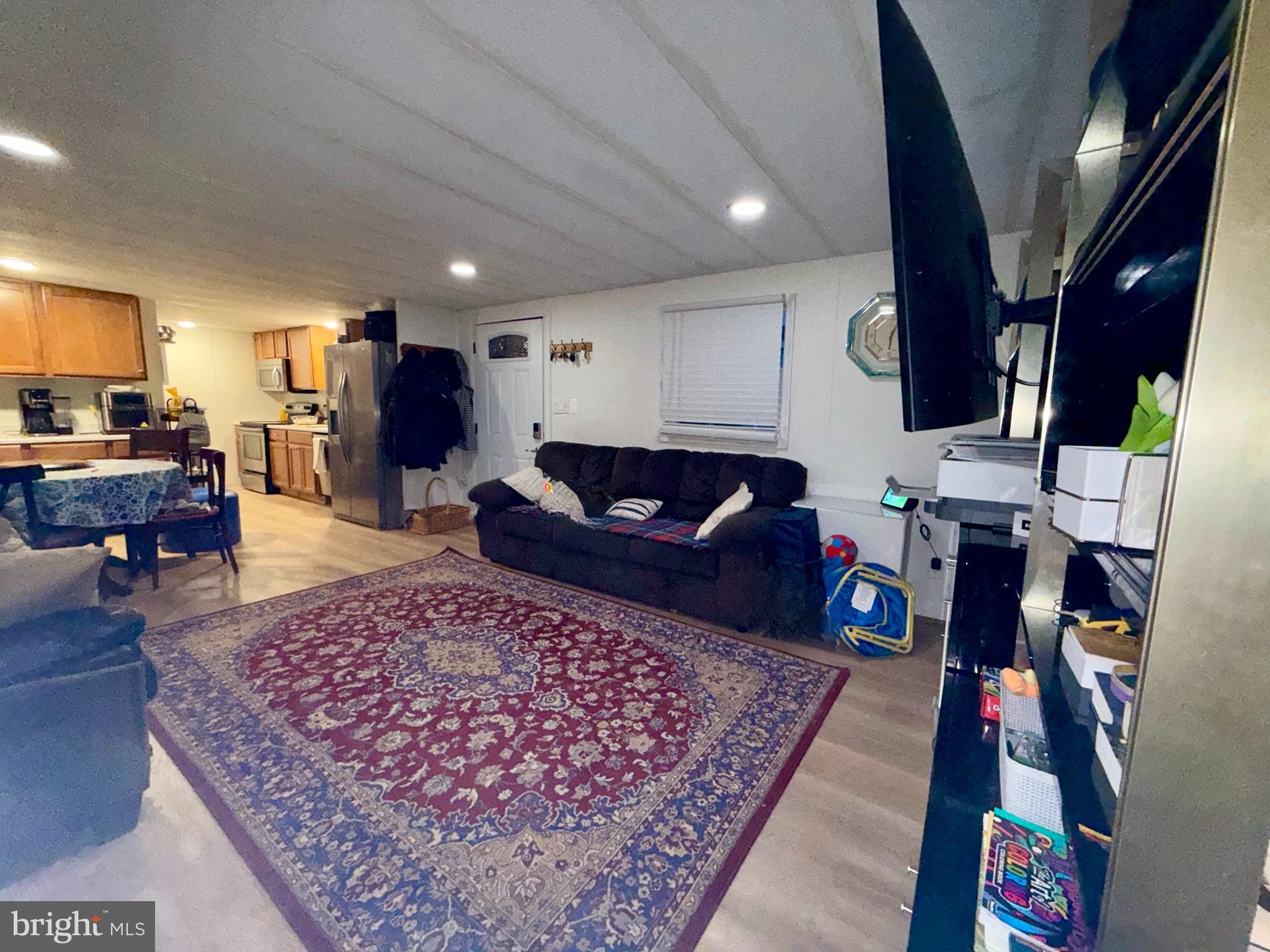 299 Rips Drive Lothian, MD 20711 - Photo 8 of 18 a living room with furniture and a wooden floor