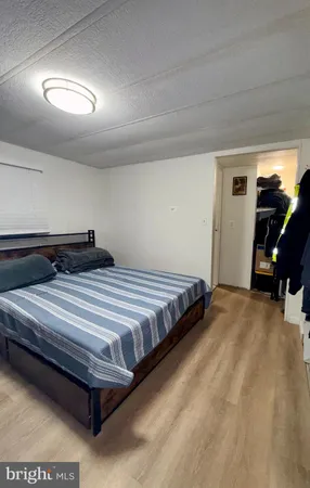 a bedroom with a bed and gym equipment