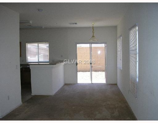 8667 Roping Rodeo Avenue, Unit 102 Las Vegas, NV 89178 - Photo 3 of 8 Living Room.