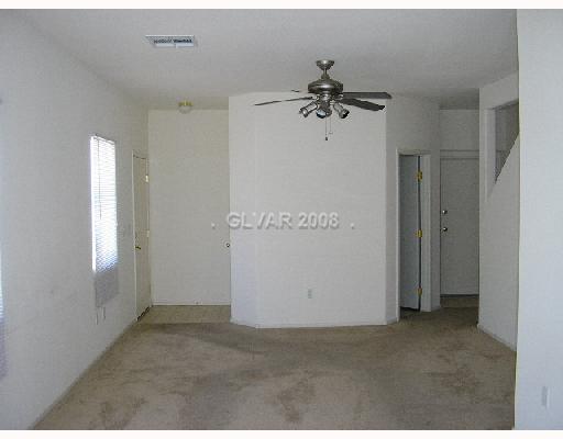 8667 Roping Rodeo Avenue, Unit 102 Las Vegas, NV 89178 - Photo 7 of 8 Living Room.