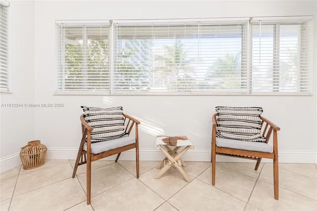a bathroom with a double vanity sink and mirror with bathtub