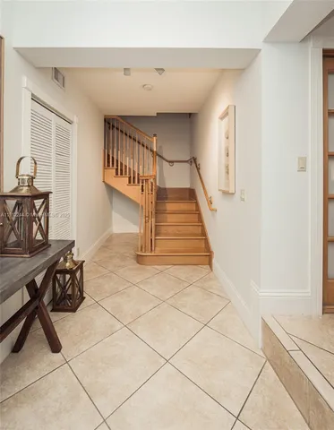 a large bedroom with a bed and large window