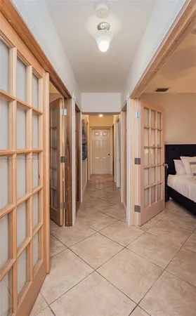 a bed room with a bed and a painting on the wall