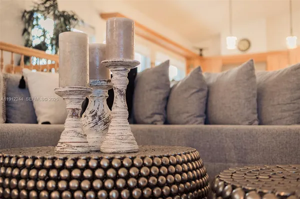 a living room with fireplace furniture and a wooden floor