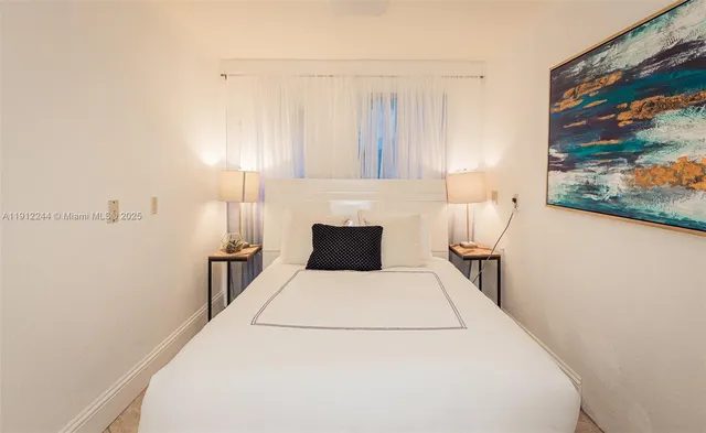 a view of a patio with table and chairs and potted plants
