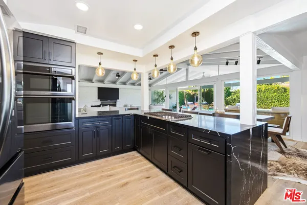 a kitchen with lots of counter space and a sink