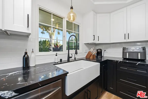 a bathroom with a shower a toilet and a sink
