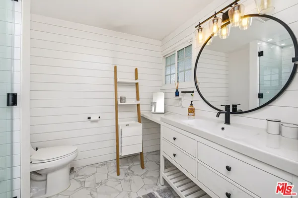 a view of a swimming pool with an outdoor space and seating area