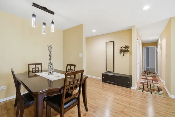 a view of a dining room with furniture and wooden floor