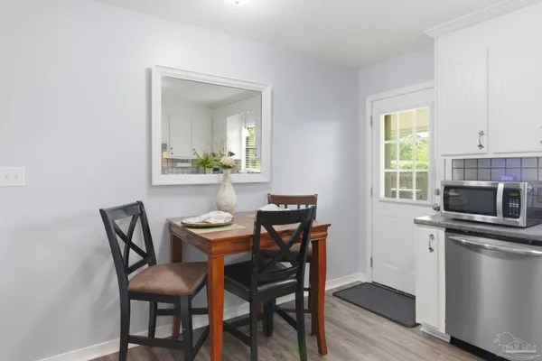 a dining room with furniture and window