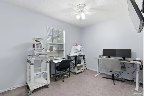 a view of a workspace with furniture