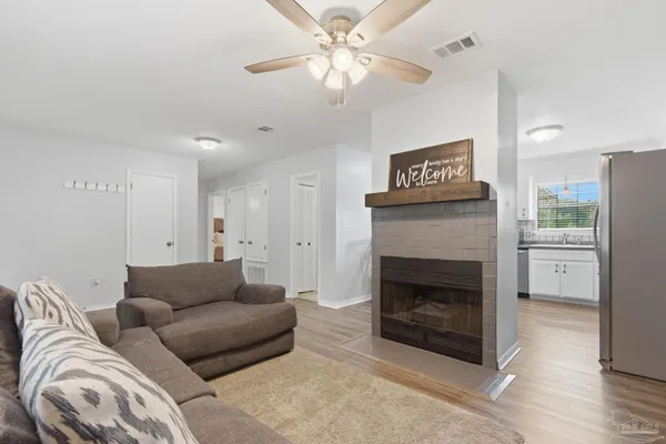 a living room with furniture and a fireplace