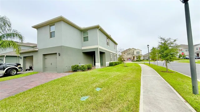 a front view of a house with swimming pool having outdoor seating