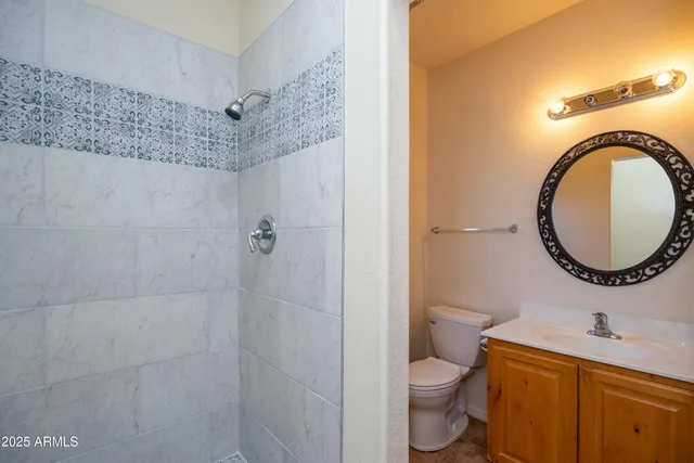 a view of a hallway with wooden door