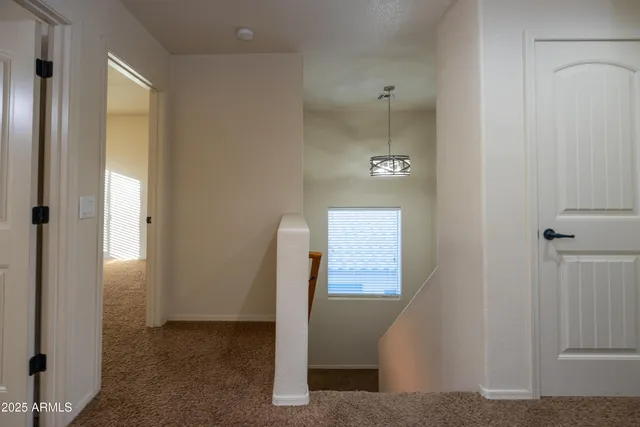a bathroom with a granite countertop toilet a sink and a mirror