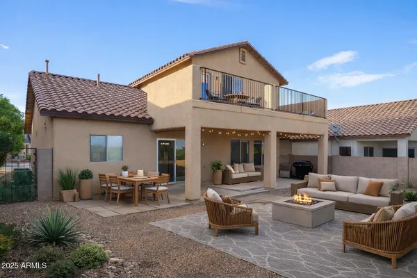 a view of a house with backyard and porch
