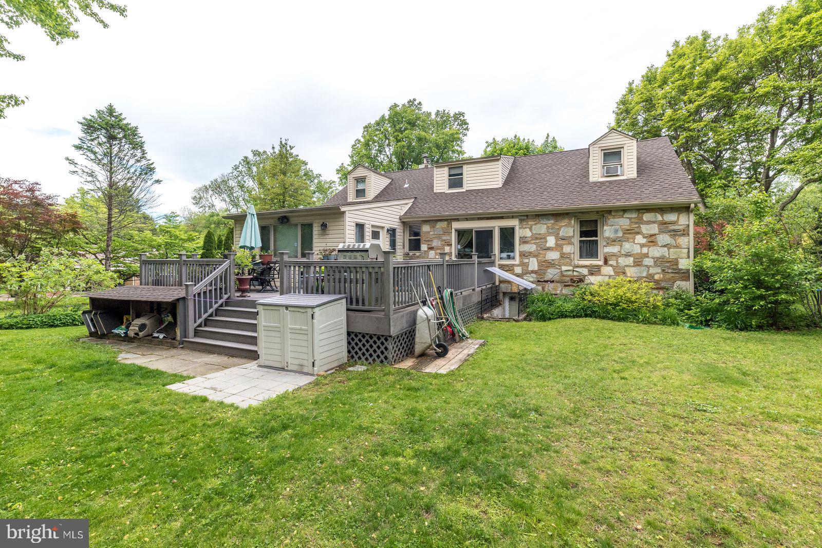 534 Pinney Road Huntingdon Valley, PA 19006 - Photo 24 of 26 a view of a house with a backyard and a patio