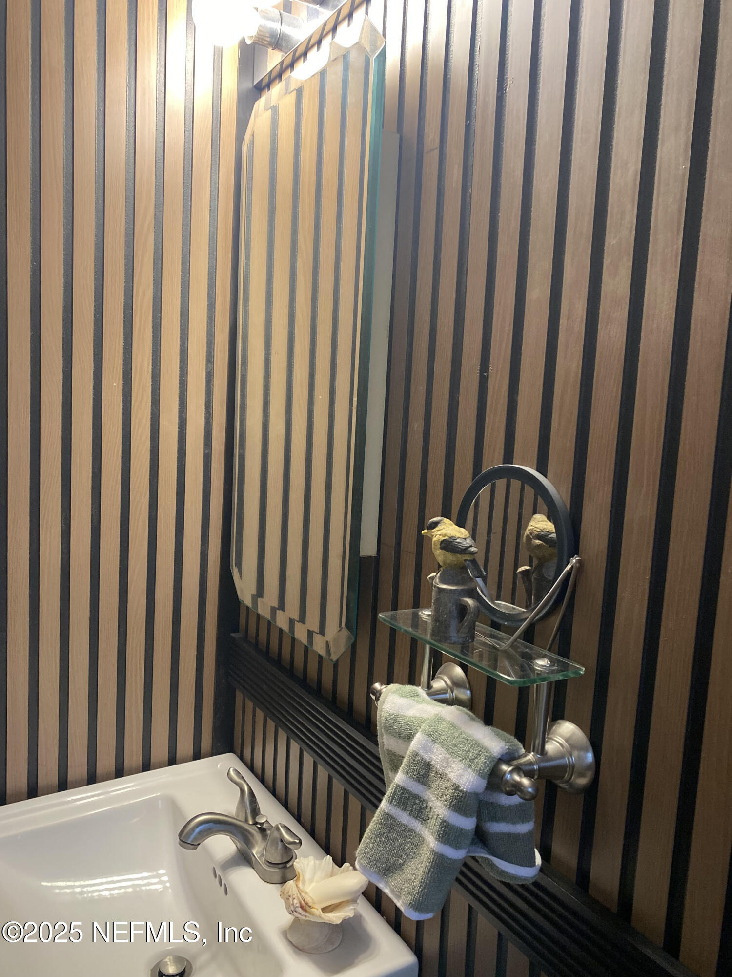 8093 Breezy Point Road East Keystone Heights, FL 32656 - Photo 19 of 35 a view of a balcony with chair and swing