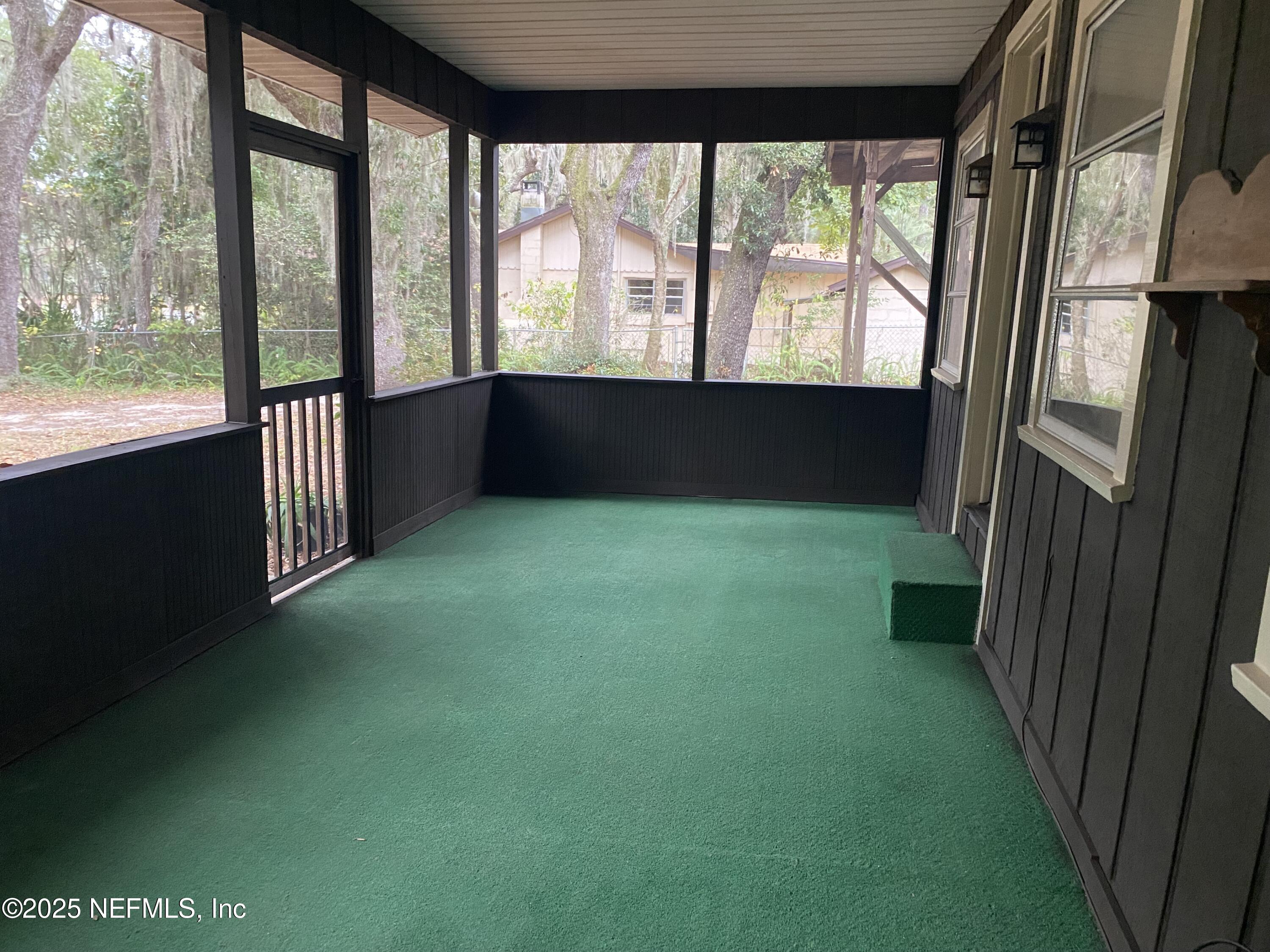 8093 Breezy Point Road East Keystone Heights, FL 32656 - Photo 21 of 35 SPACIOUS SCREENED PORCH ON LAKESIDE