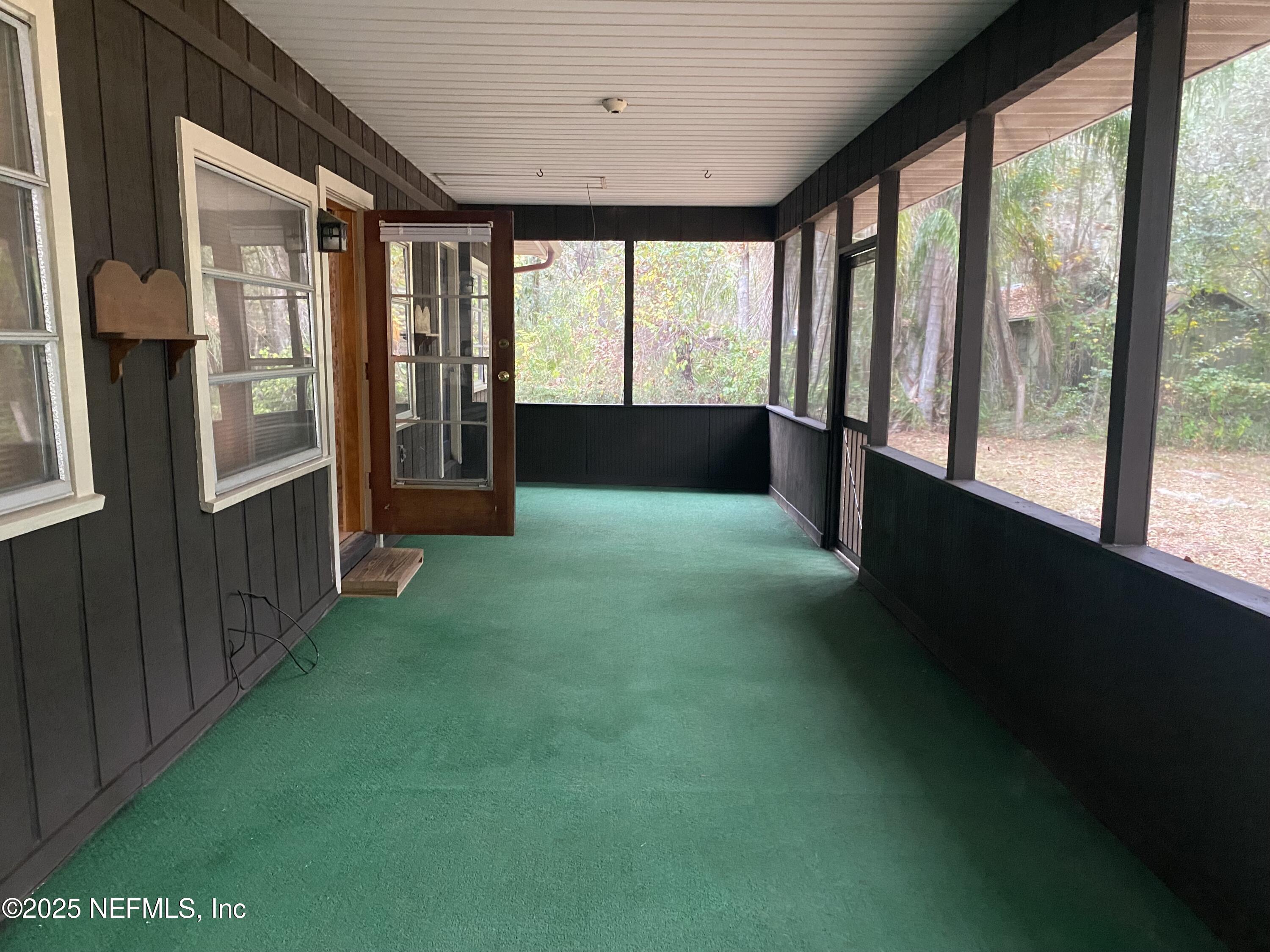 8093 Breezy Point Road East Keystone Heights, FL 32656 - Photo 22 of 35 GORGEOUS VIEWS FROM SCREENED PORCHEG