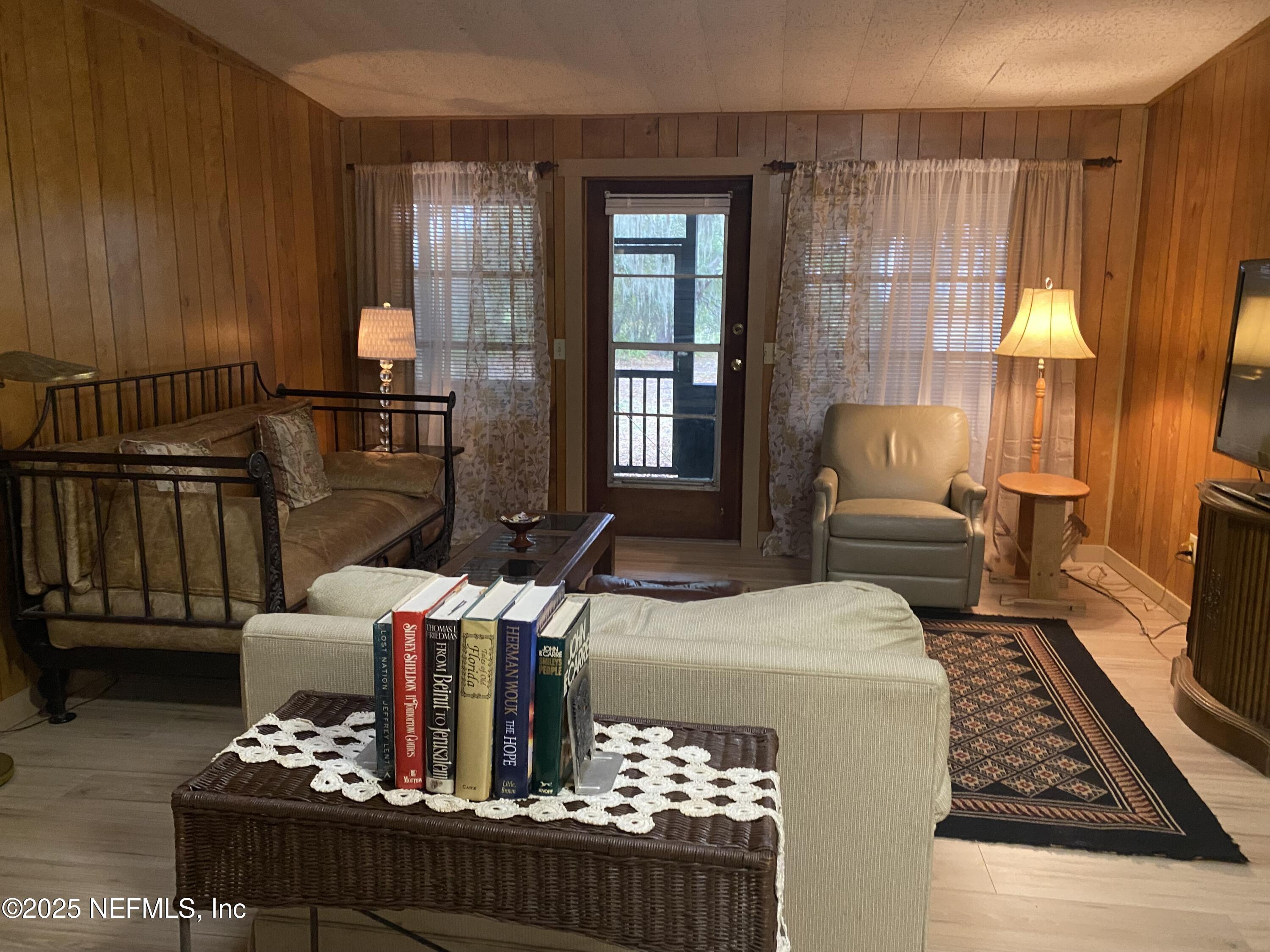 8093 Breezy Point Road East Keystone Heights, FL 32656 - Photo 7 of 35 LIVING RM IN COTTAGE 1