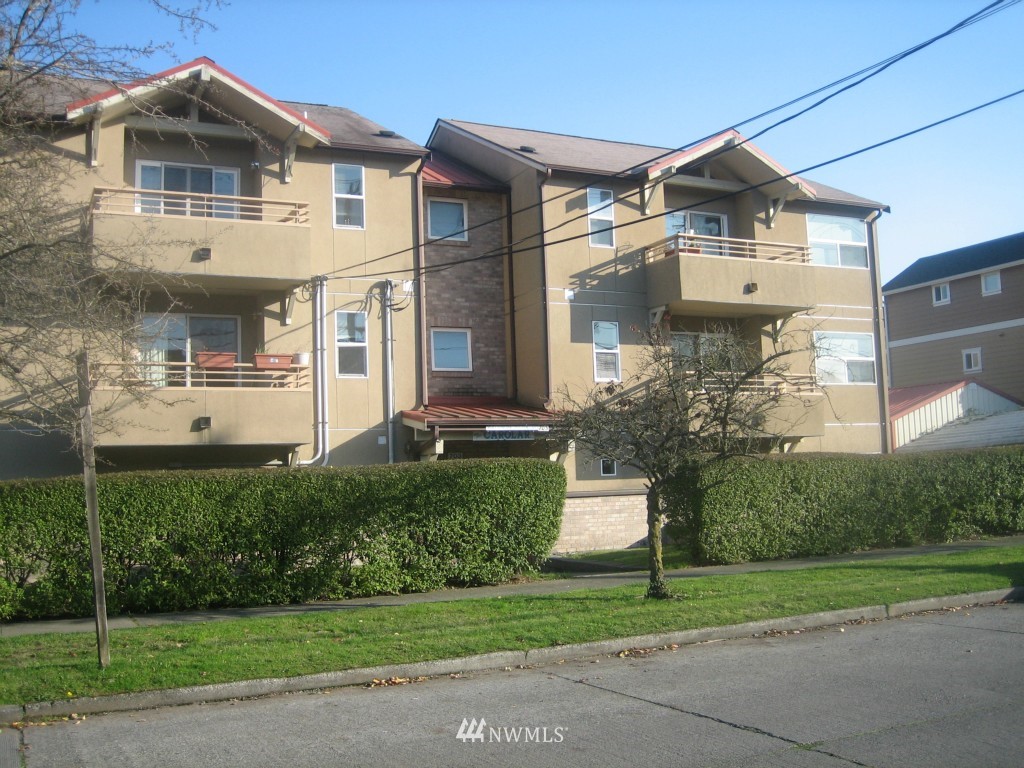 703 North 95th Street Seattle, WA 98103 - Photo 1 of 11 a front view of a house with a yard